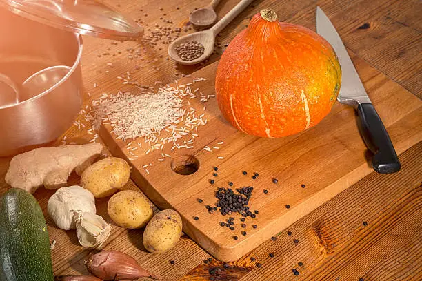 cooking scene - preparing a pumpkin soup on a countertop