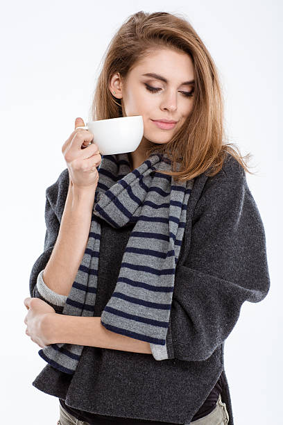 istock Woman standing with cup of coffee 495205146