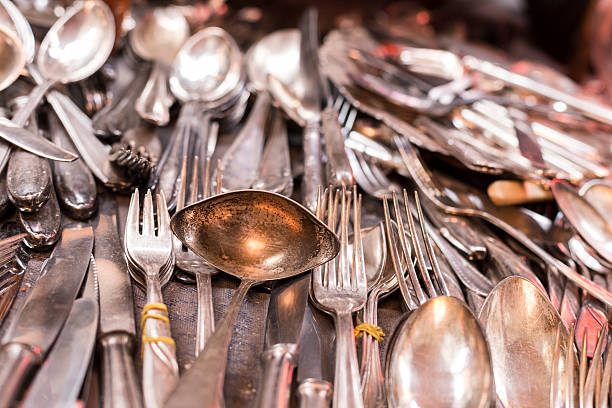 istock bunch of old silver ware on a flea market 495205938