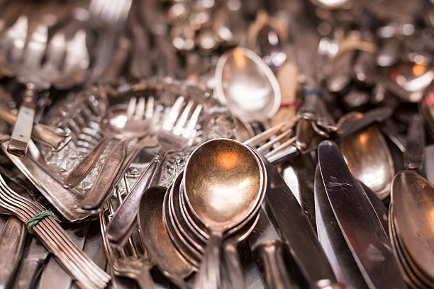 istock bunch of old silver ware on a flea market 495205988