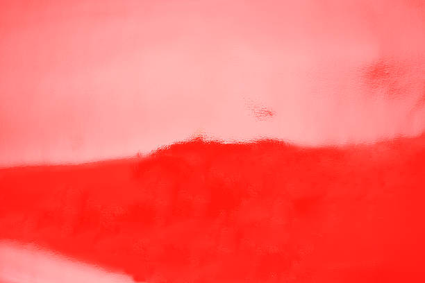 Close-up of red shiny vinyl background.
