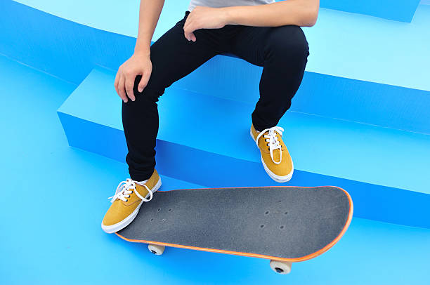 istock woman skateboarder sit rest on skatepark 495209083