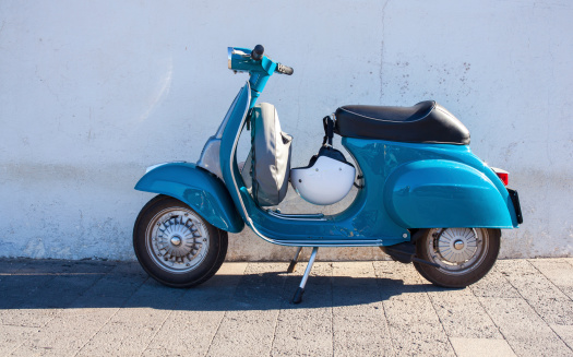 Vespa, famous italian motorcycleparked in the street