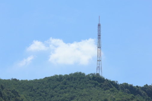 telecommunication tower on the hill with clould