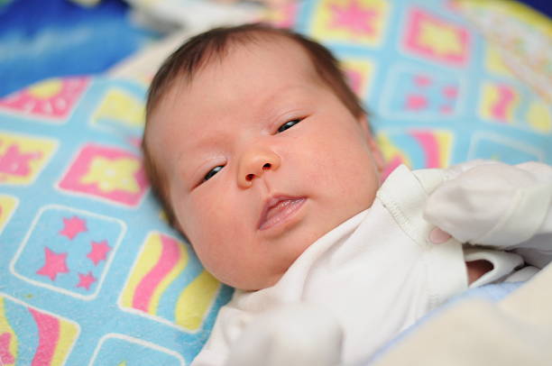 istock Newborn baby looks at you 495210775