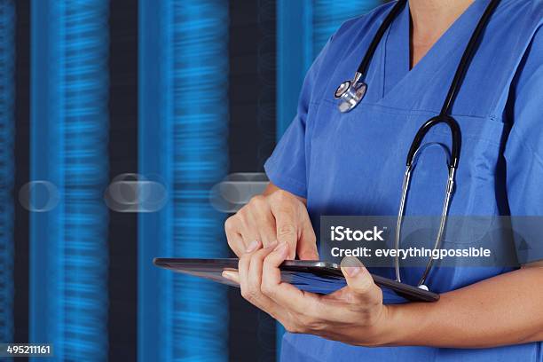 Doctor Working On A Digital Tablet Stock Photo - Download Image Now - Communication, Computer, Digital Tablet
