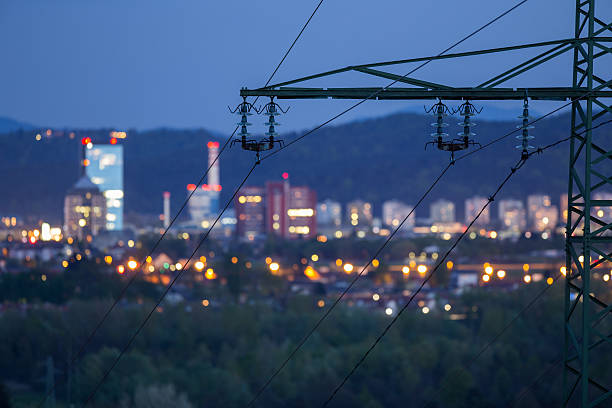High power electricty grid powering the city Photograph of high power electricity grid taken at dawn electrical grid stock pictures, royalty-free photos & images