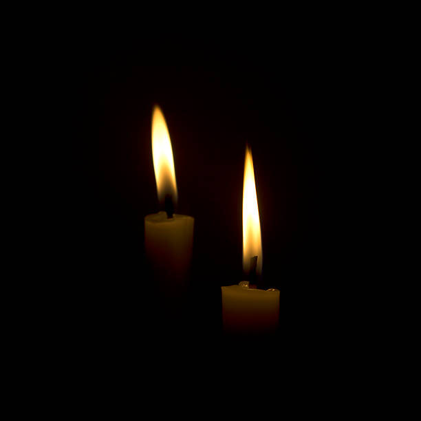 istock candle flame at night closeup - isolated 495211619