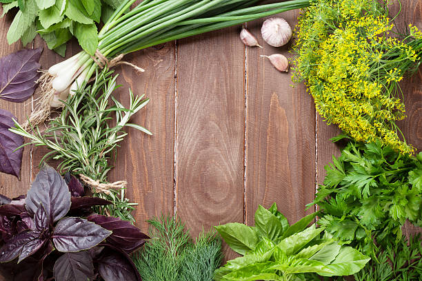 istock Fresh garden herbs on wooden table 495213182