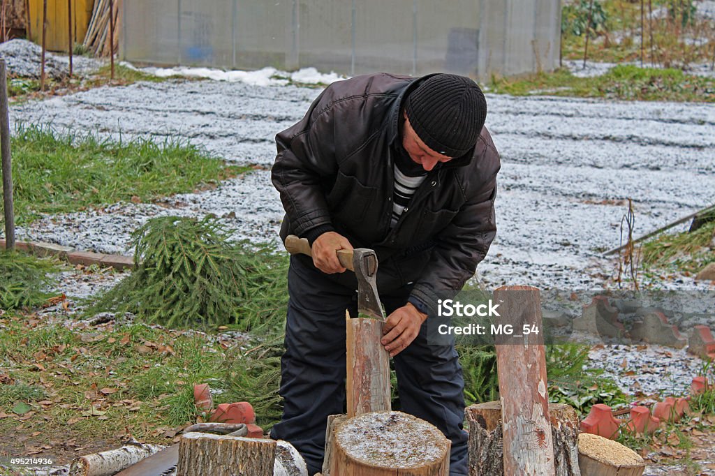 Worker with an axe in a country house 2015 Stock Photo