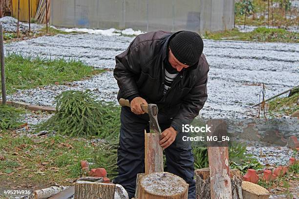 Worker With An Axe In A Country House Stock Photo - Download Image Now - 2015, Adult, Autumn