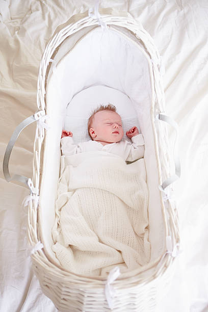 istock Newborn Baby Girl Sleeping In Cot 495215085
