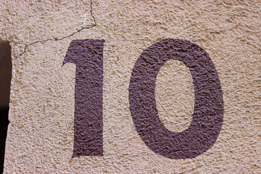 Number 10 painted on the wall of a house in France
