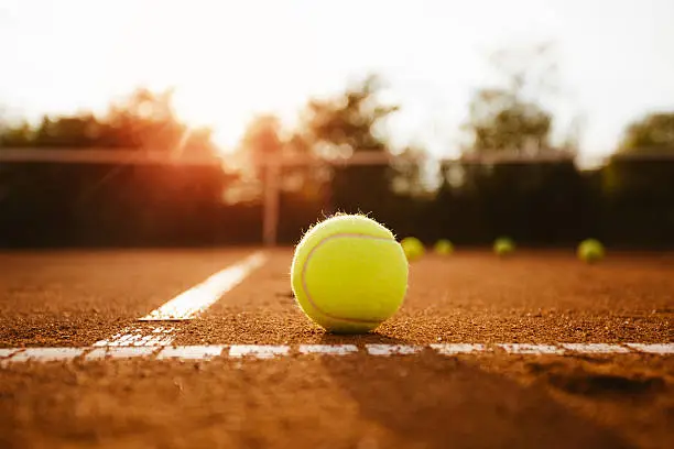 Tennis court with balls.