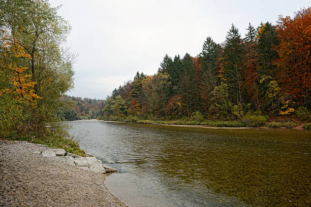 colorfull autumn time at Isar River next to village Pullach, Munich. Bavaria. Beech forest all around. hdr.