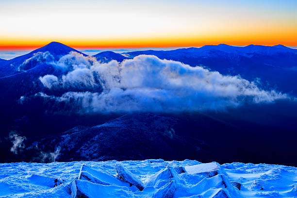 istock Sunrise in snowy mountains 495229224