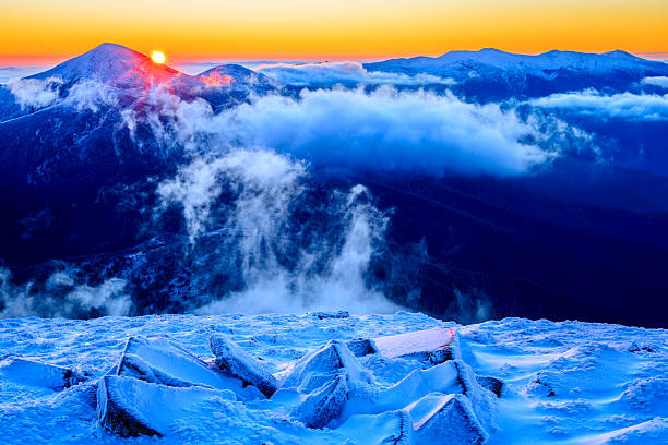 istock Sunrise in snowy mountains 495229304