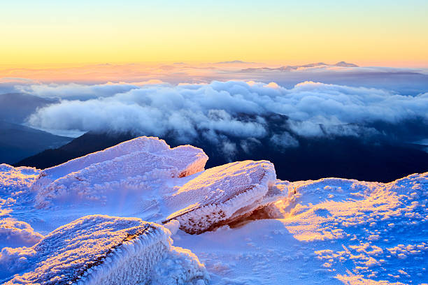 istock Sunrise in snowy mountains 495229464