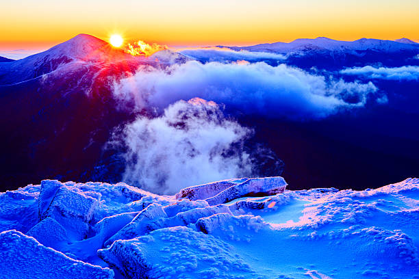 istock Sunrise in snowy mountains 495229662