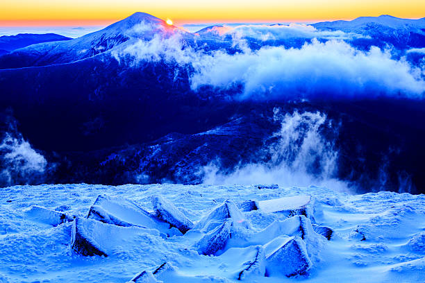 istock Sunrise in snowy mountains 495229758