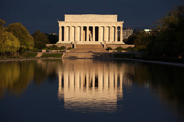 istock Lincoln Memorial and reflecting pool during stormy sunrise 495229974