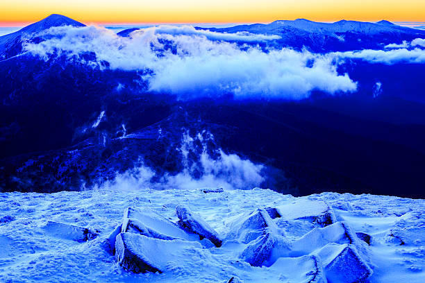 istock Sunrise in snowy mountains 495229984