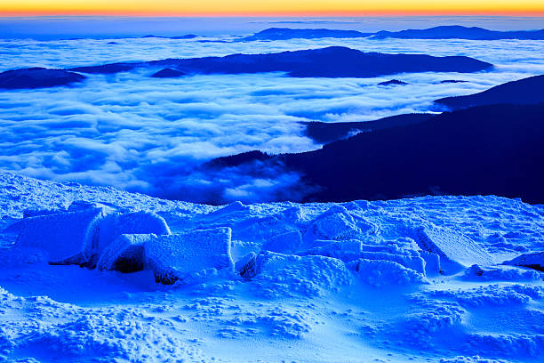 istock Sunrise in snowy mountains 495230912