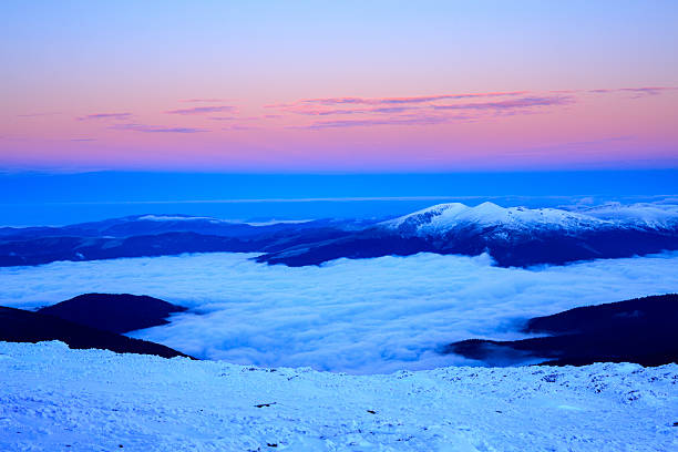 istock Sunrise in snowy mountains 495231008