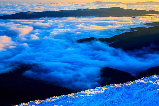 istock Sunrise in snowy mountains 495231078
