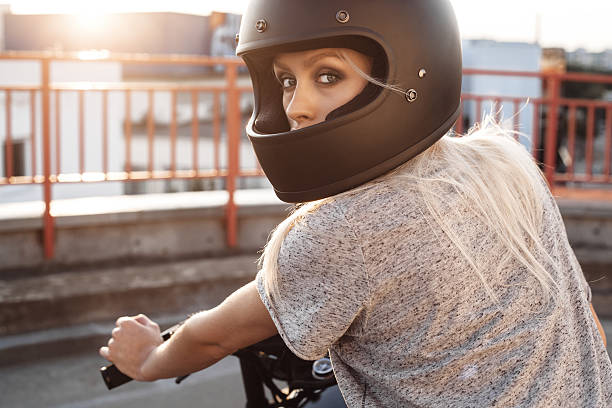 fashion female biker girl with vintage custom motorcycle stock photo