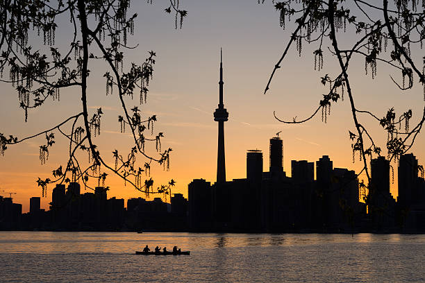istock Toronto Sunset Silhouette with  canoeists in the water 495235501