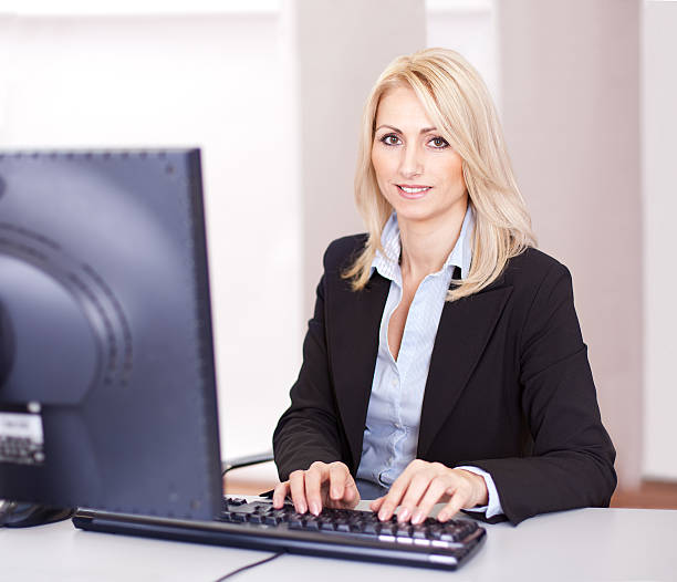 istock Beautiful businesswoman working on computer 495235765