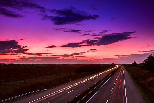 istock Cars speeding on a highway 495235775
