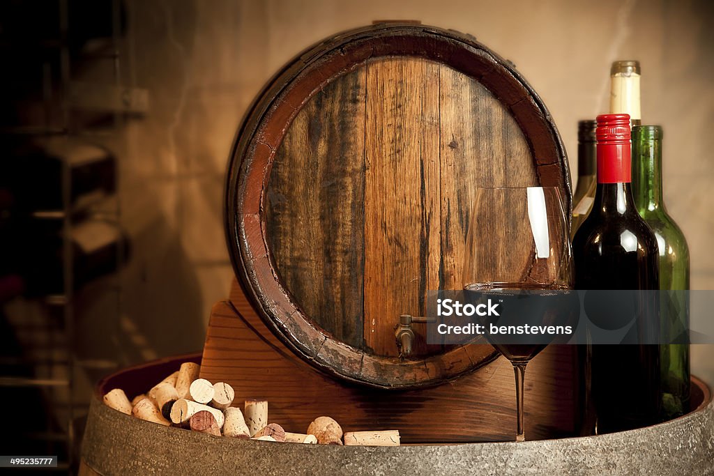 In the Cellar Tasting red wine in the cellar Shelf Stock Photo