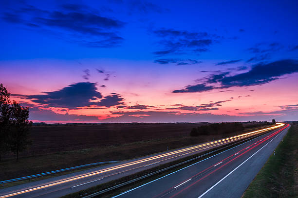 istock Cars speeding on a highway 495235797