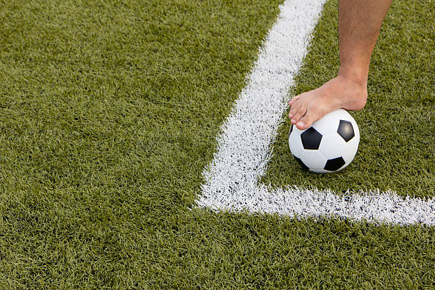 istock man foot on the soccer ball on field 495237727