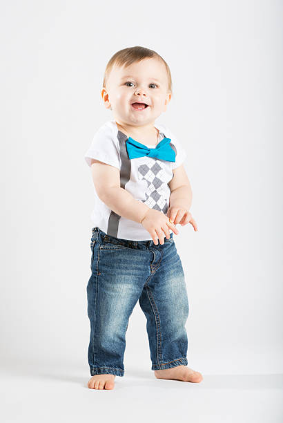 istock Baby Standing Holding Hands and Smiling 495238694