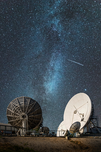 Some antennas under the Milky Way, perhaps looking for intelligent life in the space.