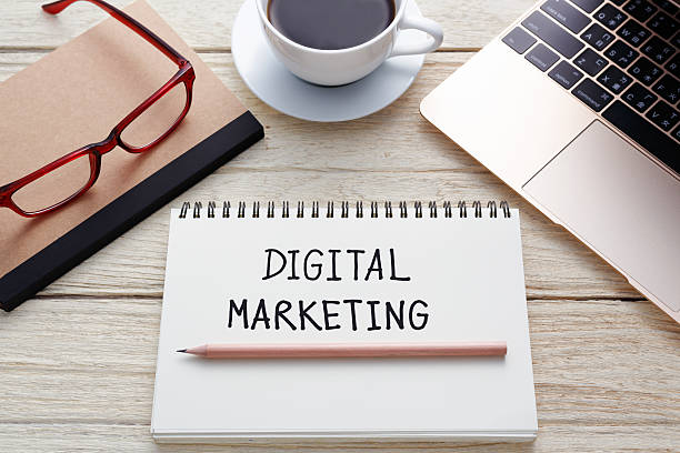 istock Digital marketing handwriting on notebook with laptop 495240122