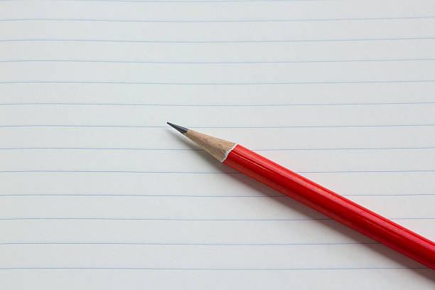 istock Red pencil on paper 495240233