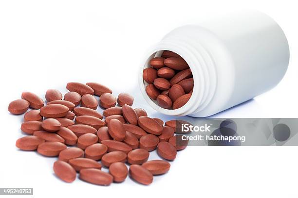 Red Pills Spilling Out Of A Medicine Bottle Stock Photo - Download Image Now - Accessibility, Acetylsalicylic Acid, Addiction