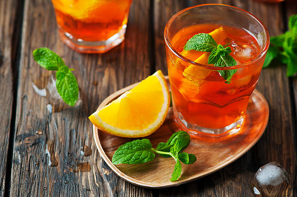 Glass of aperol with ice, orange and mint