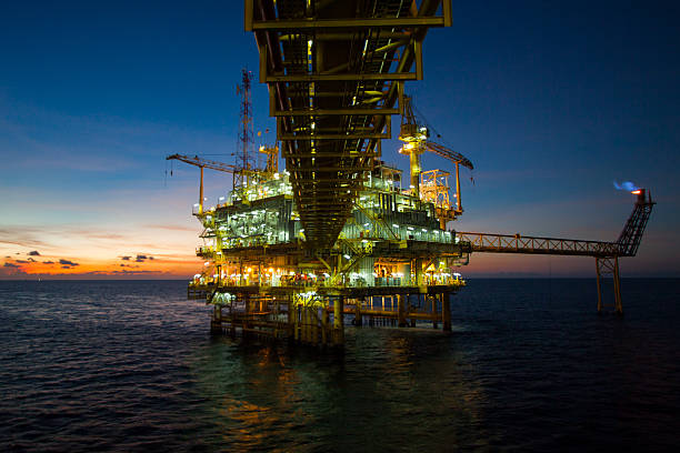 Oil and gas platform in the gulf Oil and gas platform in the gulf or the sea, Offshore oil and rig construction Platform for production oil and gas. oil derrick crane crane exploration stock pictures, royalty-free photos & images