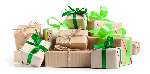 Gift boxes with recycled paper and green ribbon on white. This file is cleaned, retouched and contains clipping path.