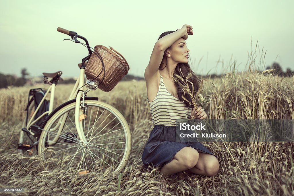 Young woman on field looking someone Fashion Model Stock Photo