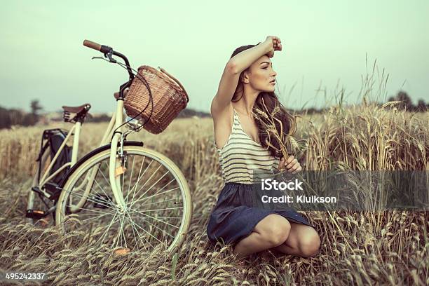 Young Woman On Field Looking Someone Stock Photo - Download Image Now - Fashion Model, Rural Scene, 20-24 Years