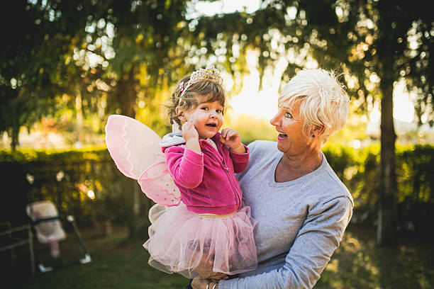 istock Grandmother carying her granddaughter 495242830