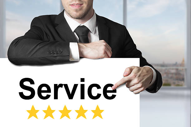 istock businessman pointing on large sign service five star rating 495242832