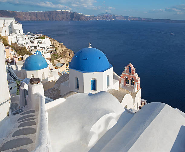 Santorini - The look to typycally blue church cupolas in Oia over the caldera.