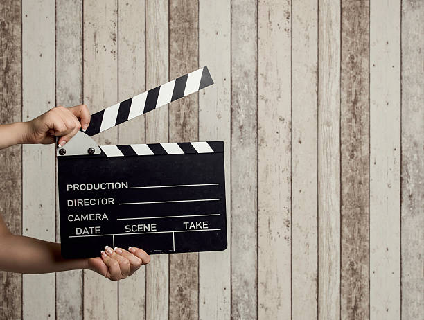 istock Wman holding a movie clapboard 495243290